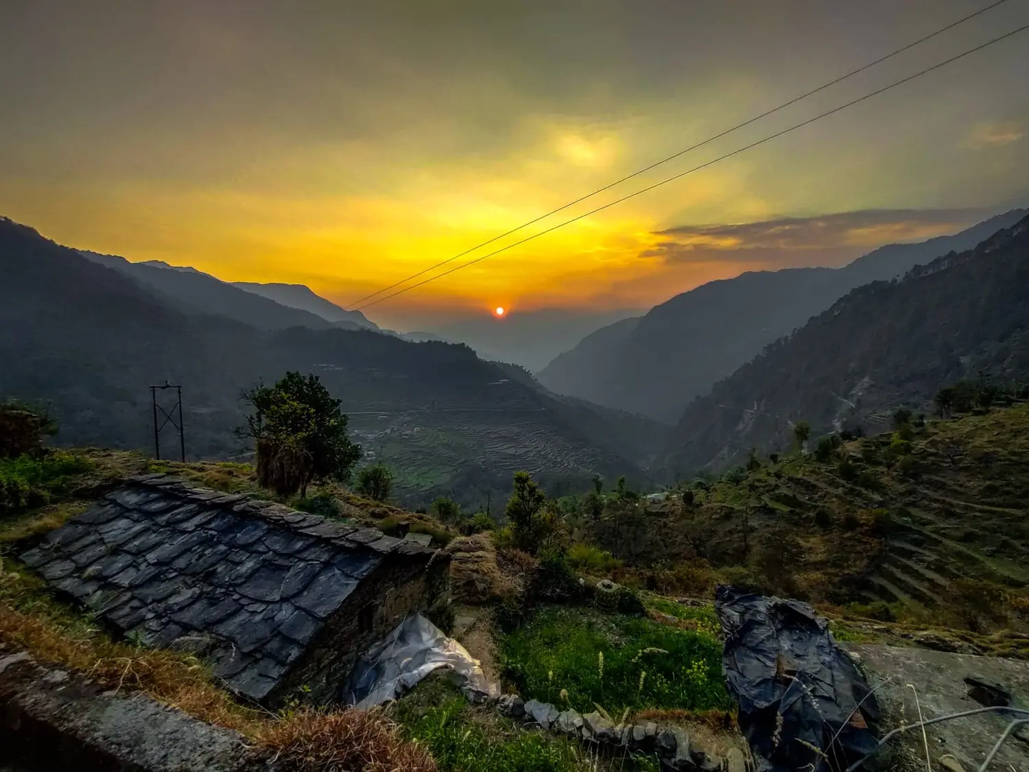 Sunset over the terraced valley below the retreat in Chopta