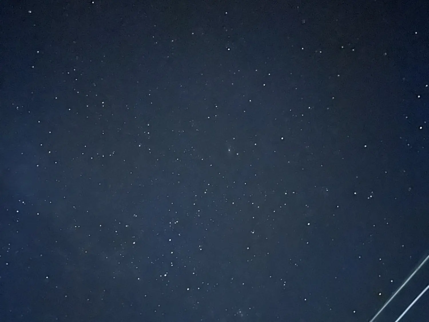 A star-filled night sky above the valley, with no light pollution
